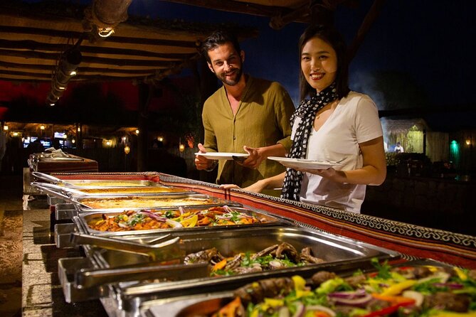 Premium Desert Safari Dubai : Dune Bashing, Camel Ride with BBQ - Camp dinner and an evening of shows