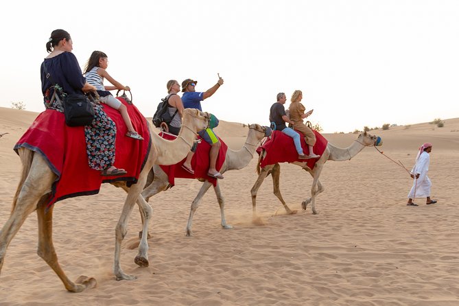 Premium Dubai Desert Safari with BBQ Dinner in the Red Dunes - Sandboarding: fun, simple, and not always smooth