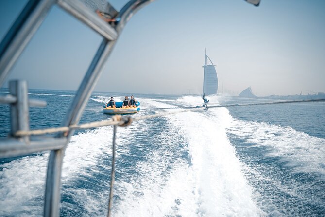 Private 60-min Group Tubing on Speedboat in Dubai - The tubing challenge: two people, one inflatable ride