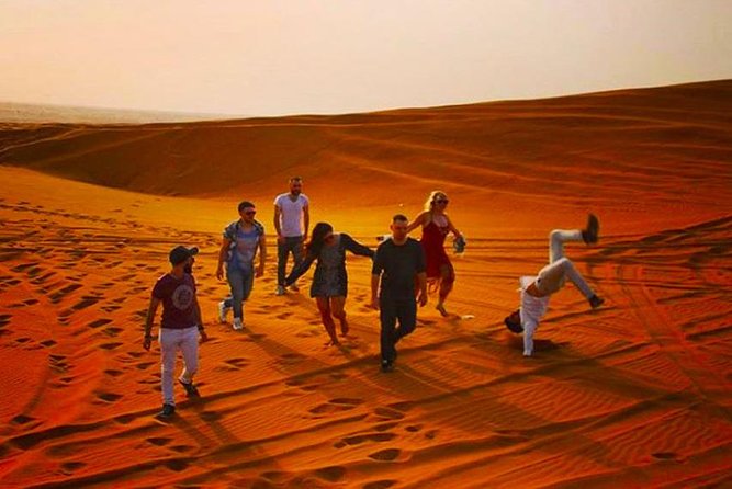 Private Desert Safari Red Dune with BBQ, Sand Boarding and Camel Ride - Sunset photos across the Lahbab Desert
