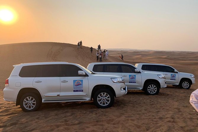 Private Evening Desert Safari with BBQ Dinner & Sand Boarding - Sandboarding and sunset photos