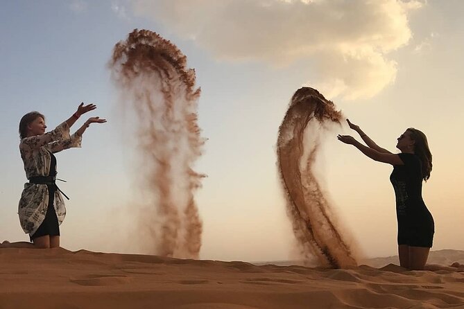 Private Evening Red Sand Desert Safari with BBQ Dinner - The camel ride and desert camp welcome