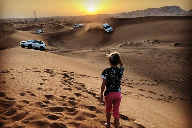 Red Dune Safari Adventure with BBQ Dinner Experience - Tanura, belly dancing, and a fire show
