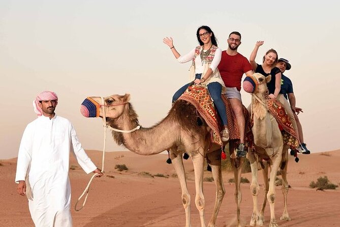 Red Dunes Desert Safari 4x4 Pickup & Drop, Camel Ride BBQ & Shows - Camel ride and sandboarding at camp