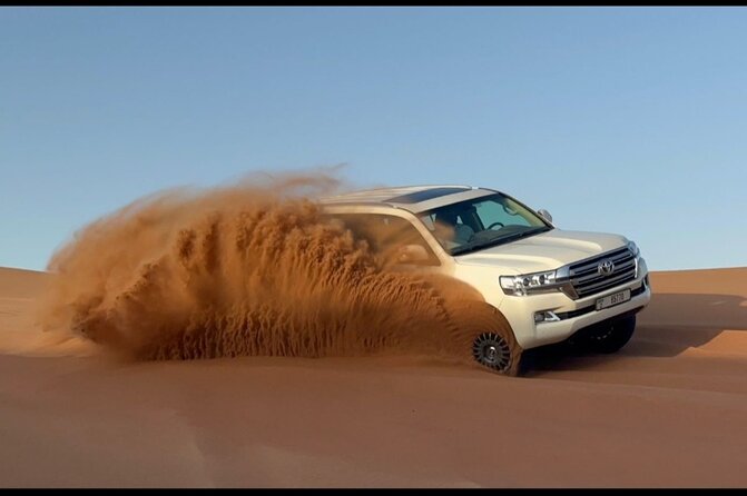 Red Dunes Desert Safari Dubai with Dinner Buffet, Show & Transfer - Dune-bashing on the red sand