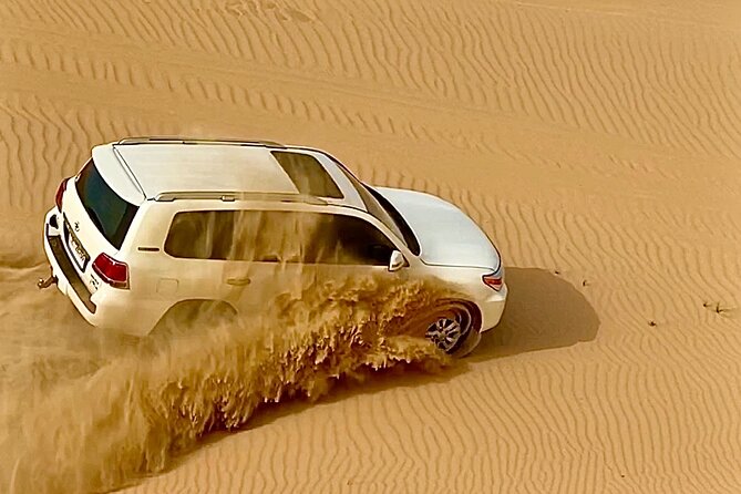 Sunrise Desert Safari from Abu Dhabi - Sand boarding with help when you need it